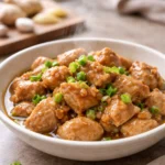 chicken with garlic and ginger in skillet sauce bowl