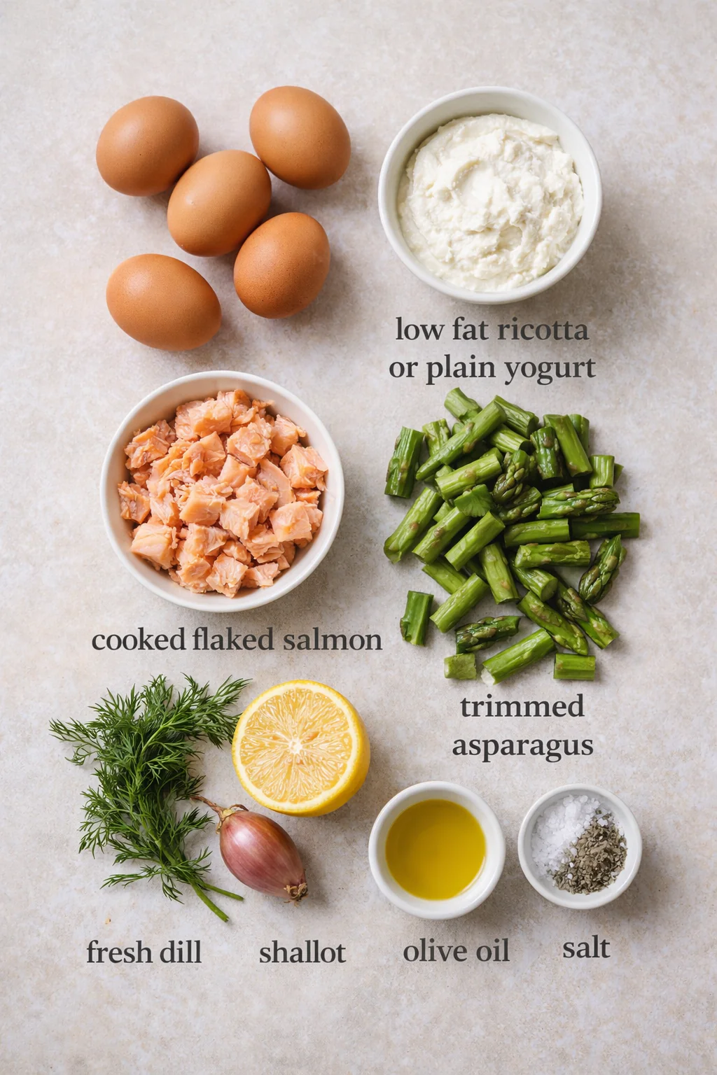 Ingredients for salmon and asparagus frittata laid out on a counter