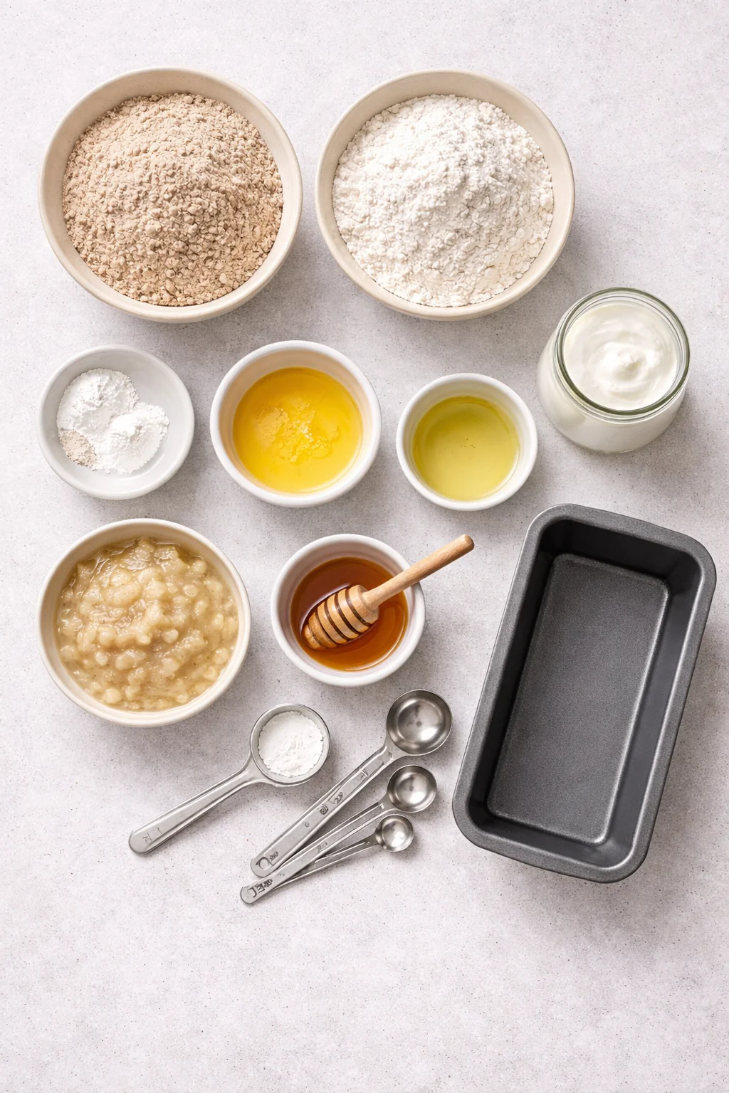 Flour eggs yogurt and oil on a countertop