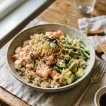 Crunchy California roll bowl with rice, crab, shrimp, avocado, cucumber, spicy mayo, nori, and sesame.